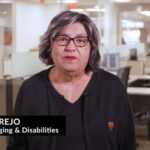 Aging and Disabilities Director Laura Trejo wearing black blouse, glasses and office in background